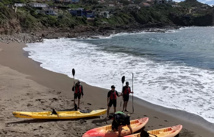 three kayaks at the beach