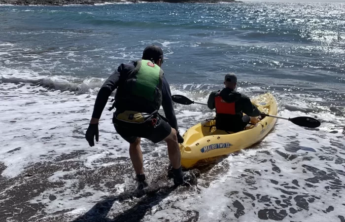 a kayak guide helping out