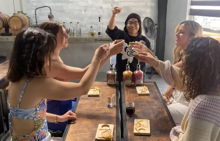 ladies toasting with tequila and mezcal