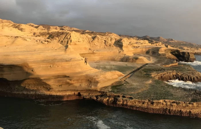 yellow sandstone coastline at sunset