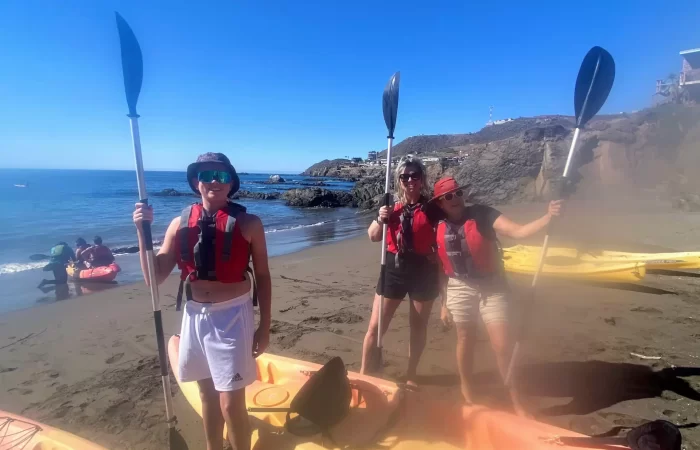 three kayaks at the beach