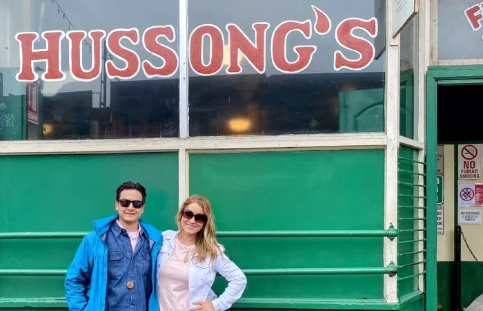 a couple at the entrance of a bar