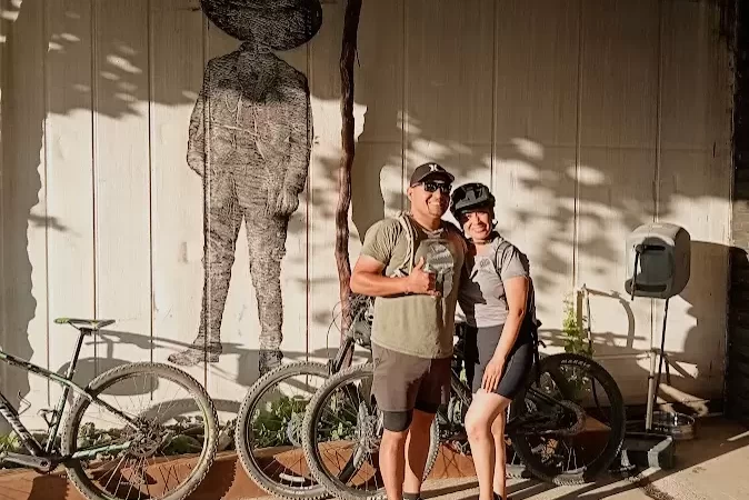 two cyclists smiling