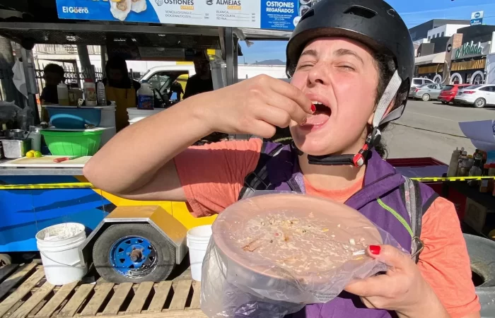 a lady eating standing up