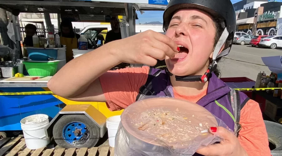 a lady eating standing up