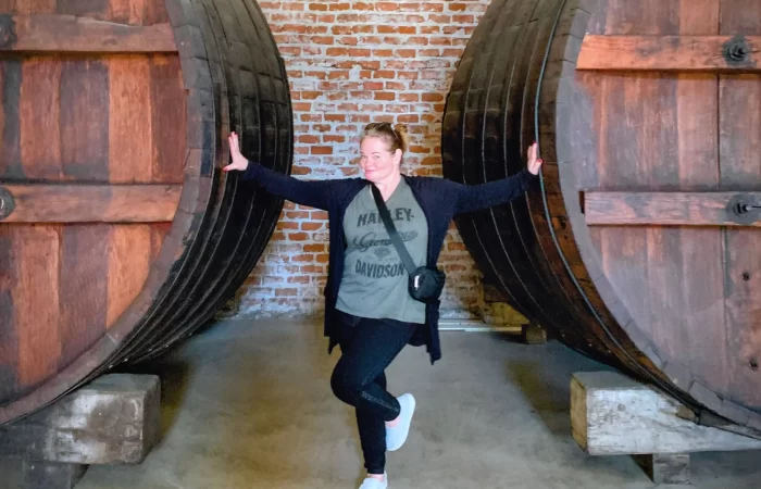 huge barrels and a lady standing