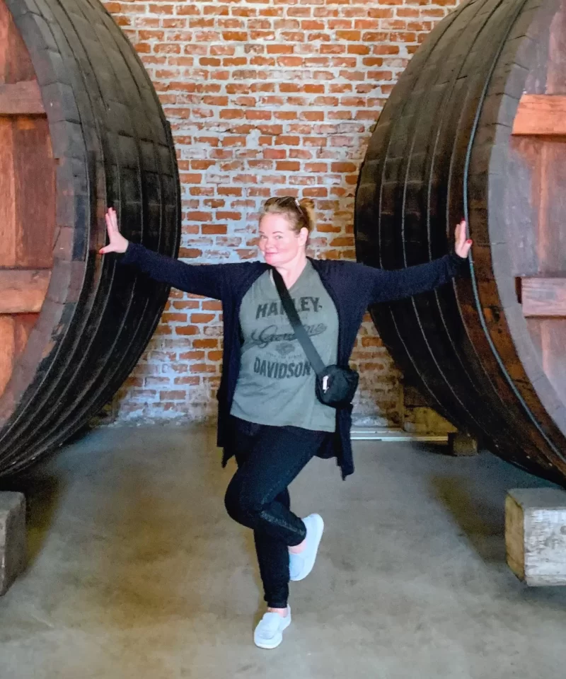 huge barrels and a lady standing