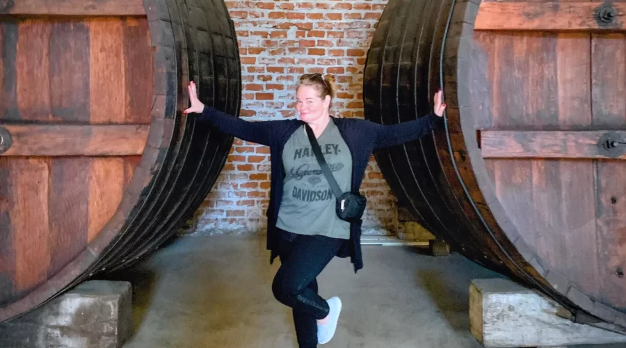 huge barrels and a lady standing