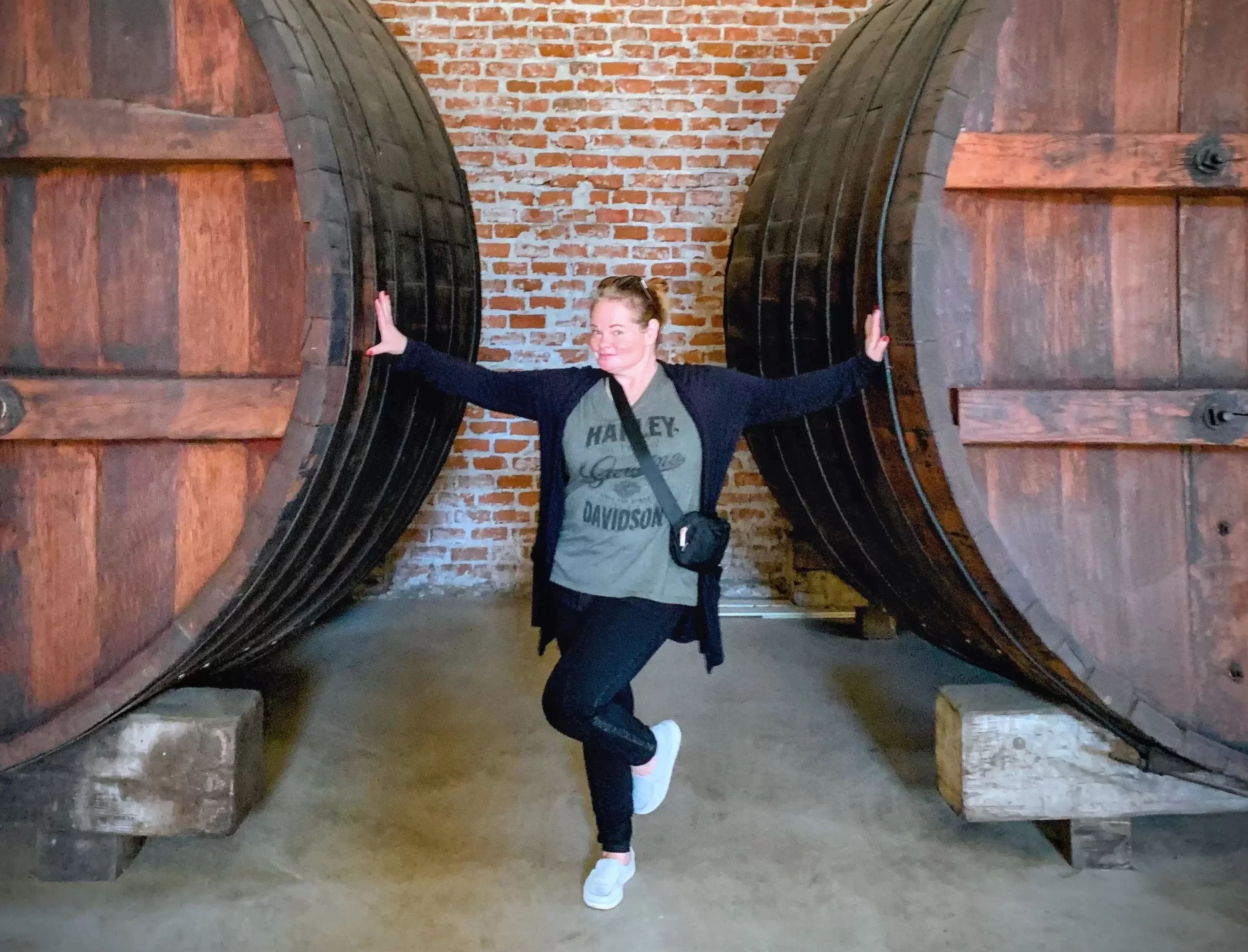 huge barrels and a lady standing